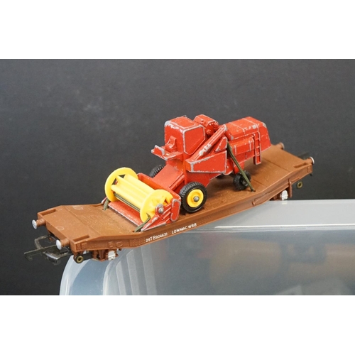 112 - Around 90 OO gauge items of rolling stock featuring tankers, vans and trucks to include Hornby, Tria... 