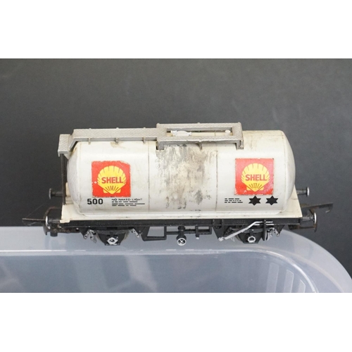 112 - Around 90 OO gauge items of rolling stock featuring tankers, vans and trucks to include Hornby, Tria... 