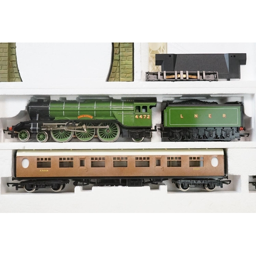 114 - Three boxed OO gauge train sets to include Hornby R176 Flying Scotsman set, Lima Inter City 125 set ... 