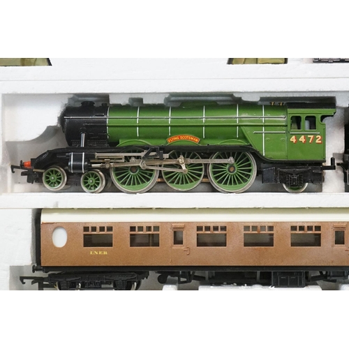 114 - Three boxed OO gauge train sets to include Hornby R176 Flying Scotsman set, Lima Inter City 125 set ... 