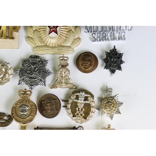 291 - A Collection Of Mainly British Military Regimental Cap Badges And Titles To Include The Royal Engine... 