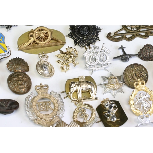 291 - A Collection Of Mainly British Military Regimental Cap Badges And Titles To Include The Royal Engine... 