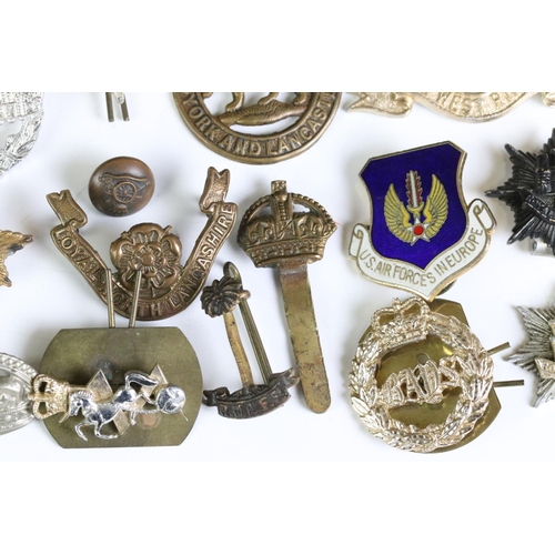 291 - A Collection Of Mainly British Military Regimental Cap Badges And Titles To Include The Royal Engine... 