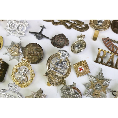 291 - A Collection Of Mainly British Military Regimental Cap Badges And Titles To Include The Royal Engine... 