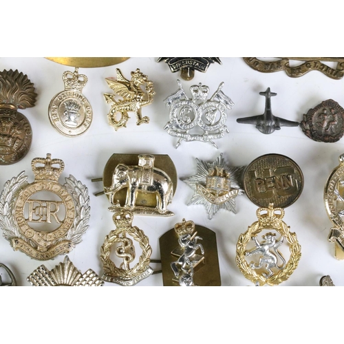 291 - A Collection Of Mainly British Military Regimental Cap Badges And Titles To Include The Royal Engine... 