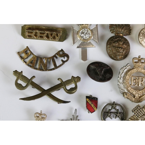 291 - A Collection Of Mainly British Military Regimental Cap Badges And Titles To Include The Royal Engine... 