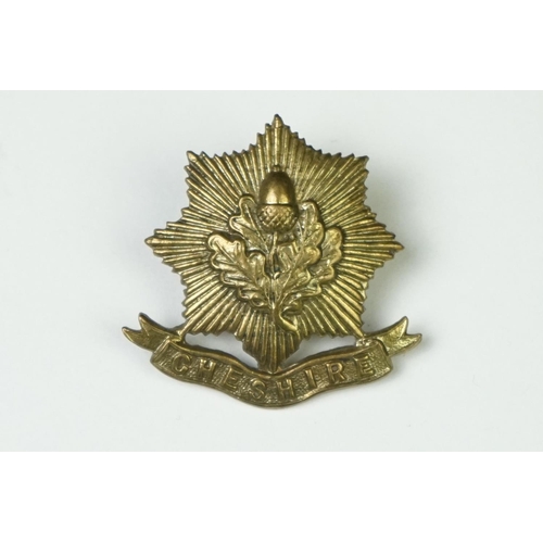 5 - A British Military The Cheshire Regiment All Brass Other Ranks Cap Badge With Slider Fixing To Verso... 