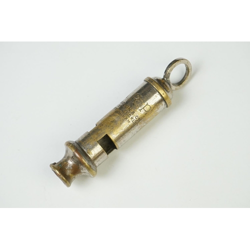 9 - A Collection Of Four British Military Issued Whistles To Include Air Raid Precautions Examples.