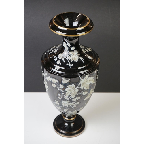 2 - Late 19th Century Black Urn-shaped Glass Vase enamelled with butterflies amongst leafy branches, wit... 