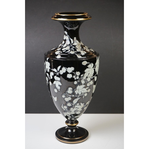 2 - Late 19th Century Black Urn-shaped Glass Vase enamelled with butterflies amongst leafy branches, wit... 