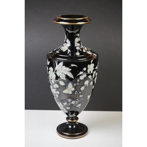 2 - Late 19th Century Black Urn-shaped Glass Vase enamelled with butterflies amongst leafy branches, wit... 