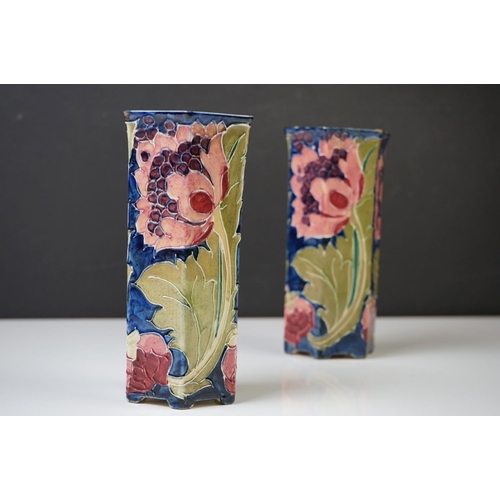 28 - Two Bursley Ware ' Seed Poppy ' pattern tube lined hexagonal vases, designed by Charlotte Rhead, mea... 