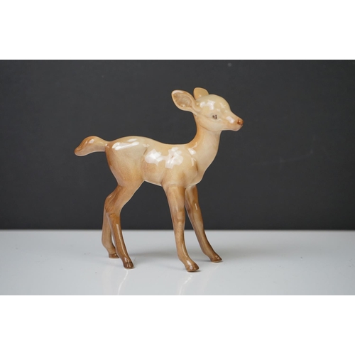 39 - Three Beswick Deer figures to include 981 Stag (19cm high), 999 Doe and 1000 Fawn