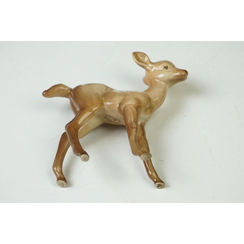 39 - Three Beswick Deer figures to include 981 Stag (19cm high), 999 Doe and 1000 Fawn