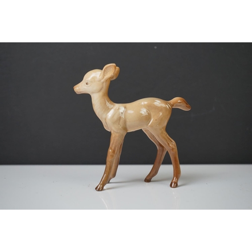 39 - Three Beswick Deer figures to include 981 Stag (19cm high), 999 Doe and 1000 Fawn