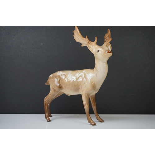 39 - Three Beswick Deer figures to include 981 Stag (19cm high), 999 Doe and 1000 Fawn