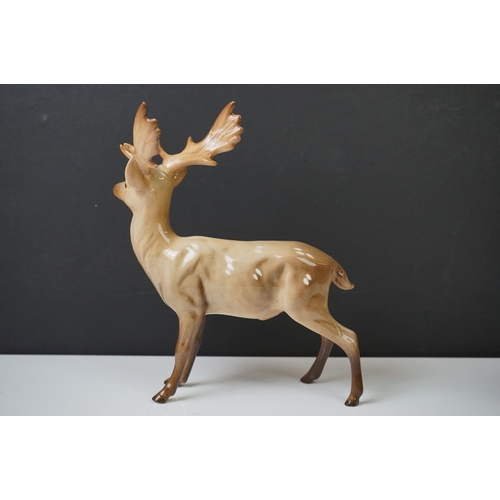 39 - Three Beswick Deer figures to include 981 Stag (19cm high), 999 Doe and 1000 Fawn