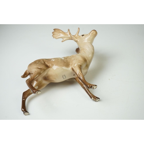 39 - Three Beswick Deer figures to include 981 Stag (19cm high), 999 Doe and 1000 Fawn