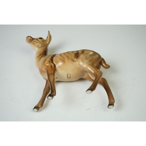 39 - Three Beswick Deer figures to include 981 Stag (19cm high), 999 Doe and 1000 Fawn