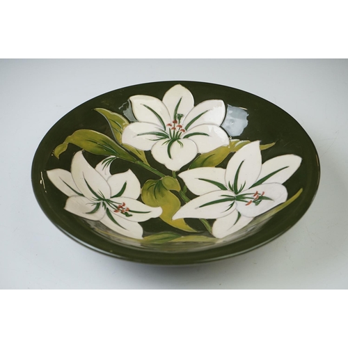 52 - Moorcroft ' Bermuda Lily ' pattern green ground circular bowl, 25cm diameter