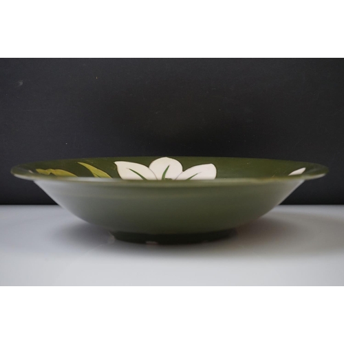 52 - Moorcroft ' Bermuda Lily ' pattern green ground circular bowl, 25cm diameter