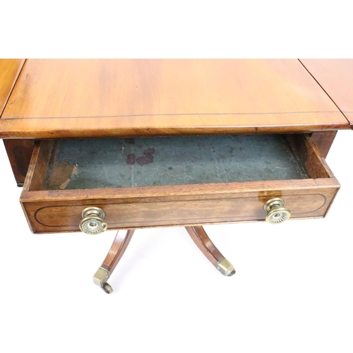 588 - Regency Mahogany Drop Flap Breakfast Table, two drawers to either end,  raised on quadruped swept su... 