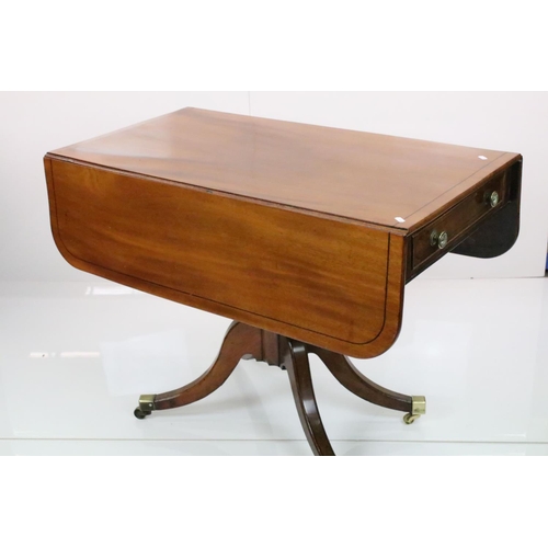 588 - Regency Mahogany Drop Flap Breakfast Table, two drawers to either end,  raised on quadruped swept su... 