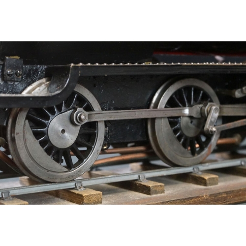 135A - Metal/brass O gauge 2-6-0 steam locomotive painted in black livery, contained ithin wooden box with ... 