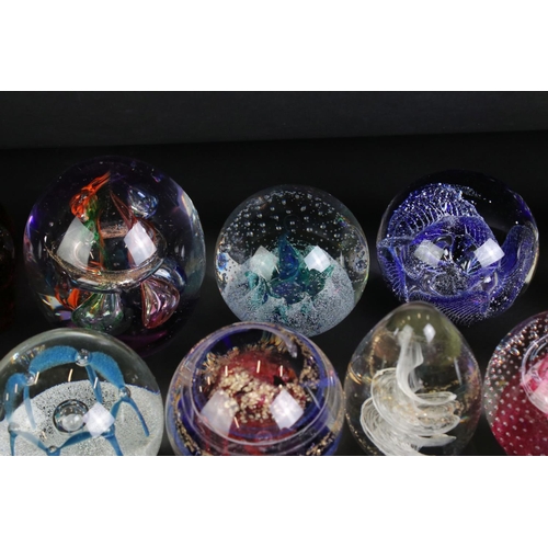 112 - Collection of approximately Thirty Five Glass Paperweights including Caithness and Langham, some in ... 