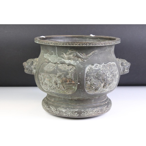 138 - Japanese Bronze Censer with dogs of foe twin handles and relief panels of mythical creatures and dra... 