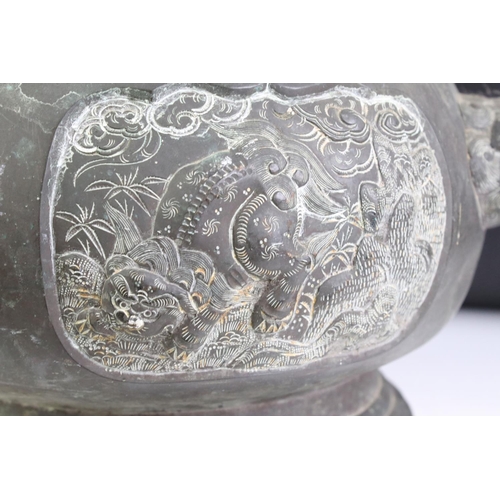 138 - Japanese Bronze Censer with dogs of foe twin handles and relief panels of mythical creatures and dra... 