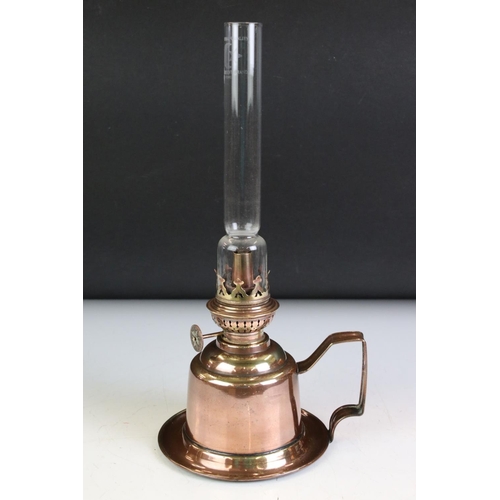 142 - Brass Spring Loaded Candle Holder with glass shade, 39cm high together with Two Oil Lamps with tall ... 