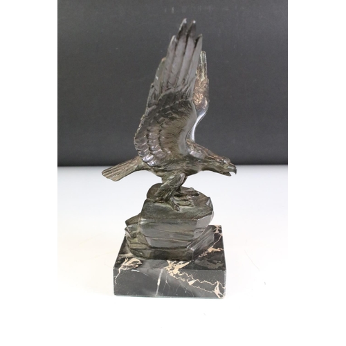 149 - Bronze effect Metal Eagle on a Rock mounted on a marble base, 24cm high together with a Brass Model ... 