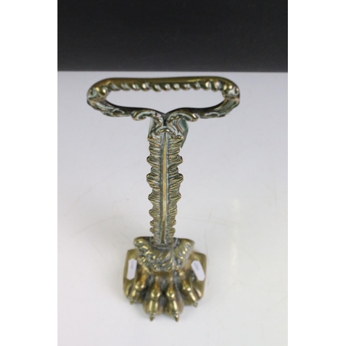 164 - 19th century Brass ' Lion Paw ' Doorstop with foliate loop handle and weighted base, 39.5cm high