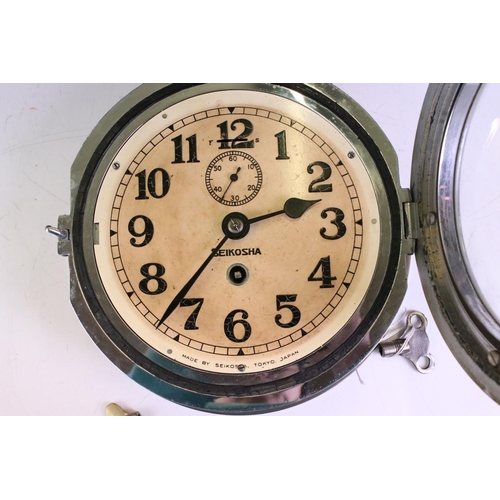 185 - Seikosha Ship's Circular Brass Bulkhead Clock, the dial with Arabic numerals, fast / slow switch and... 