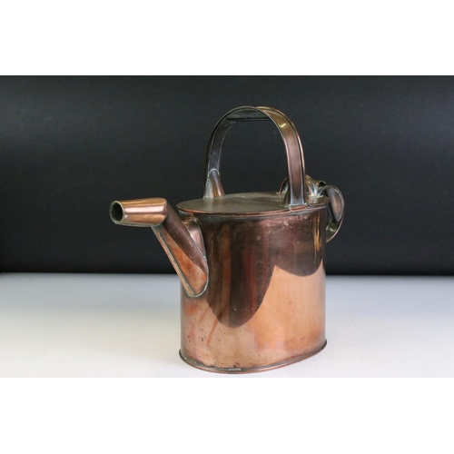 189 - Late 19th / Early 20th century Copper Watering Can with hinged half lid, 28cm high