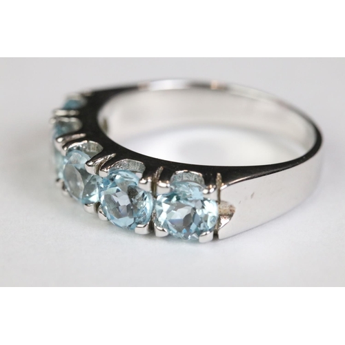 223 - Silver and blue topaz five stone ring