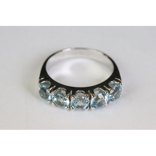 223 - Silver and blue topaz five stone ring