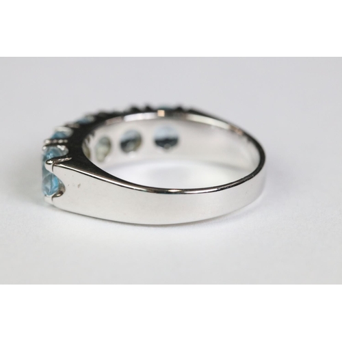 223 - Silver and blue topaz five stone ring