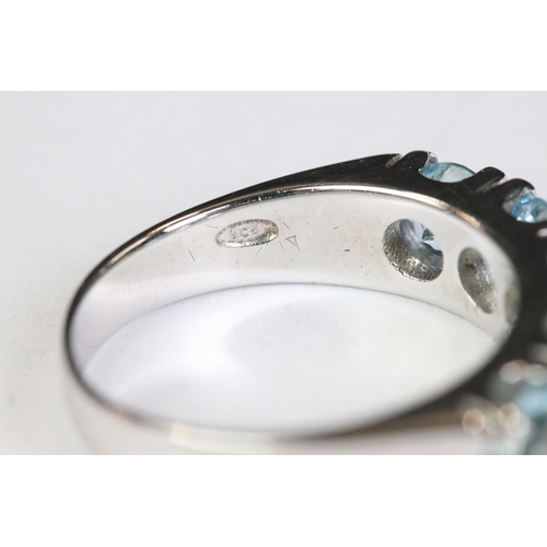 223 - Silver and blue topaz five stone ring