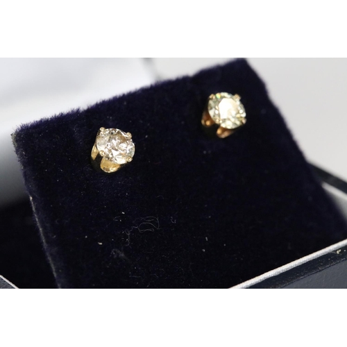 239 - Pair of 18ct white gold diamond stud earrings of 60 points