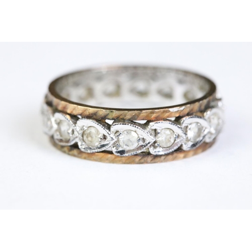 246 - A ladies 18ct gold and diamond ring together with an eternity ring.