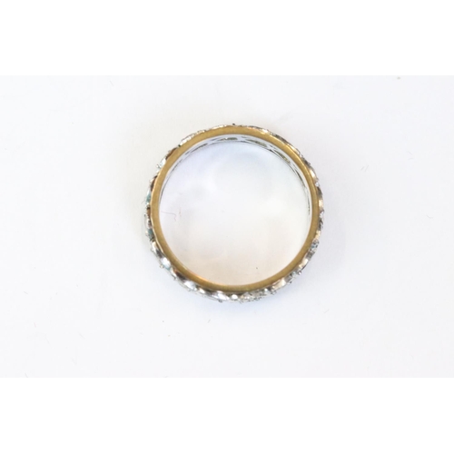 246 - A ladies 18ct gold and diamond ring together with an eternity ring.