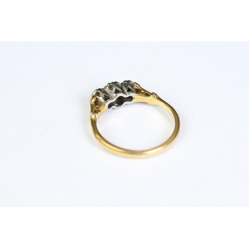 246 - A ladies 18ct gold and diamond ring together with an eternity ring.