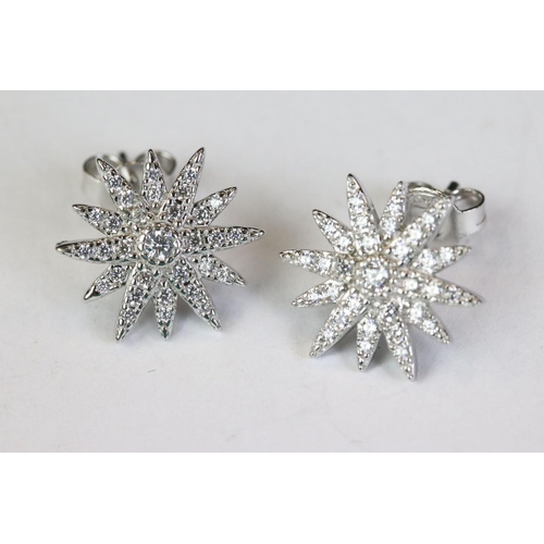 247 - Pair of silver and CZ sunburst style stud earrings