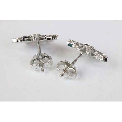 247 - Pair of silver and CZ sunburst style stud earrings