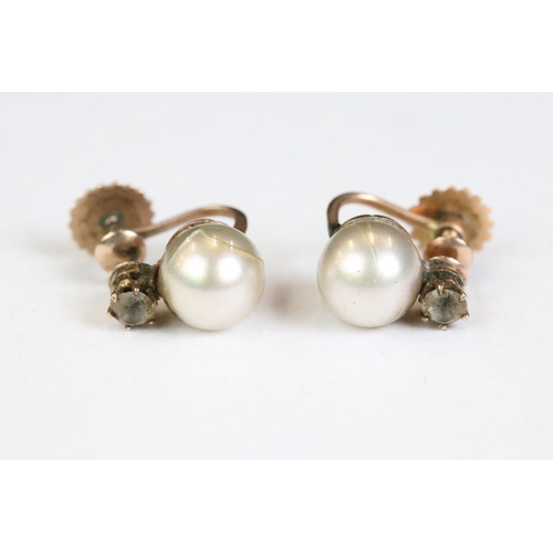 248 - A pair of early 20th century yellow metal screw back earrings.