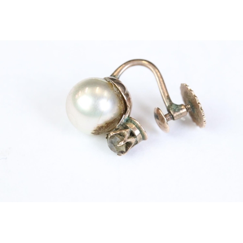 248 - A pair of early 20th century yellow metal screw back earrings.