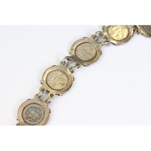 253 - A silver coin bracelet mounted with King George V threepence coins together with a sterling silver b... 