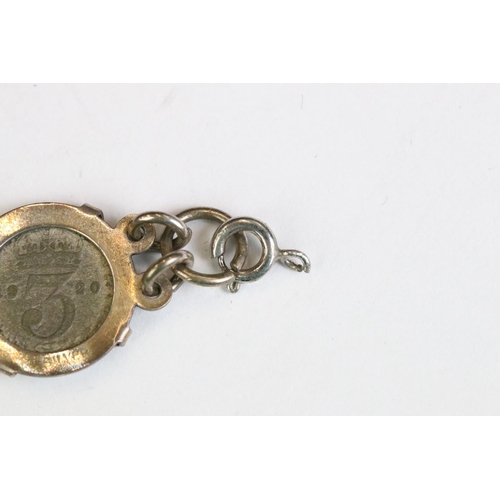 253 - A silver coin bracelet mounted with King George V threepence coins together with a sterling silver b... 